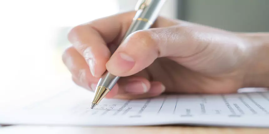 cA astudent giving mock test paper