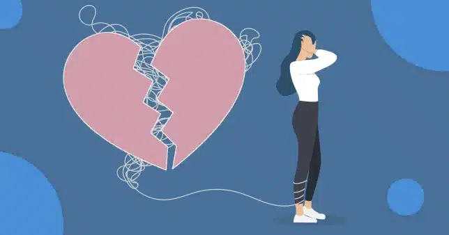 a girl standing and is ties with the rope of heart break